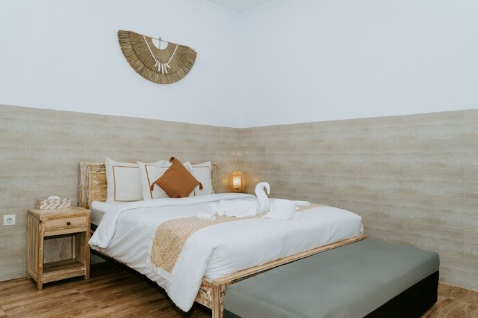 Imagen de la habitación del Hotel Agung Wiwin Homestay. Foto 27