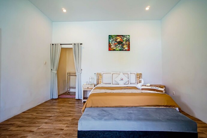 Imagen de la habitación del Hotel Agung Wiwin Homestay. Foto 28