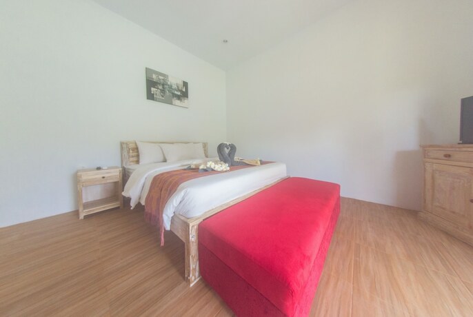 Imagen de la habitación del Hotel Agung Wiwin Homestay. Foto 33