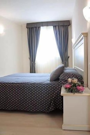 Imagen de la habitación del Hotel Ai Dogi. Foto 15