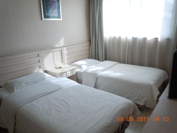 Imagen de la habitación del Hotel Ai Hua. Foto 4