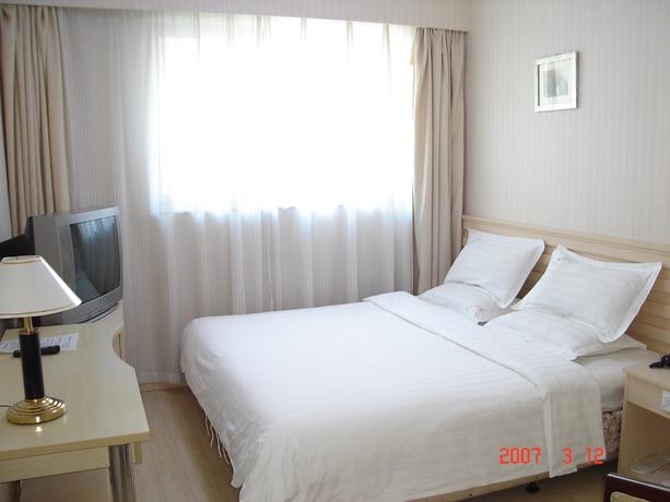 Imagen de la habitación del Hotel Ai Hua. Foto 5