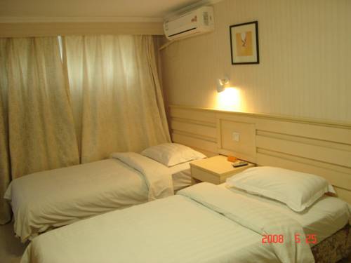 Imagen de la habitación del Hotel Ai Hua. Foto 6