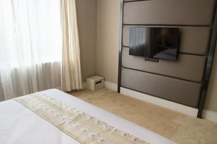 Imagen de la habitación del Hotel Ai Luo Si. Foto 3