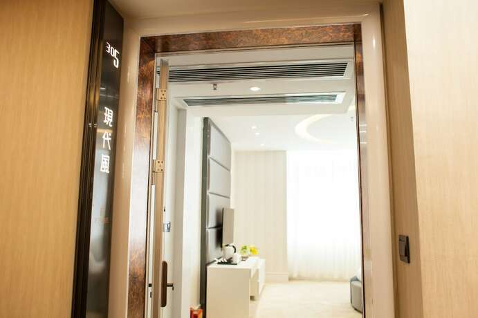 Imagen de la habitación del Hotel Ai Luo Si. Foto 6