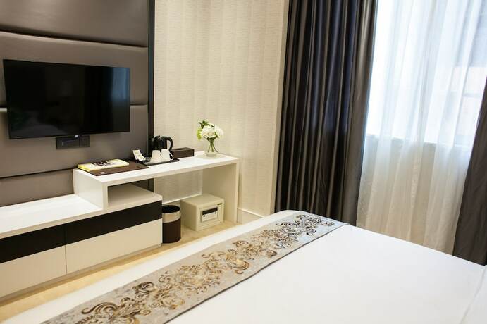 Imagen de la habitación del Hotel Ai Luo Si. Foto 11