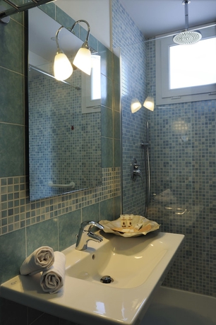 Imagen de la habitación del Hotel Ai Pozzi Village Resort and Spa. Foto 14