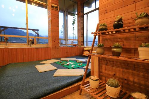 Imagen de la habitación del Hotel Ai Shang Jia Guesthouse. Foto 8