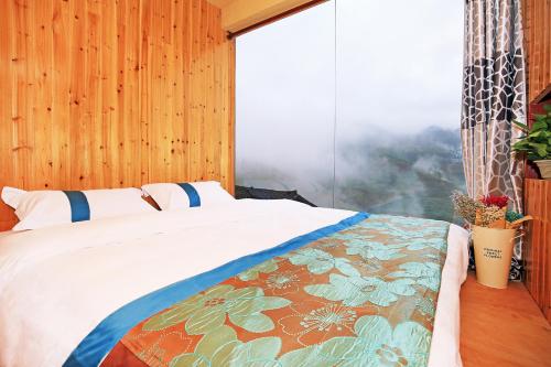 Imagen de la habitación del Hotel Ai Shang Jia Guesthouse. Foto 9