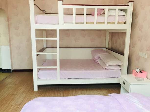 Imagen de la habitación del Hotel AiShang Hostel. Foto 4