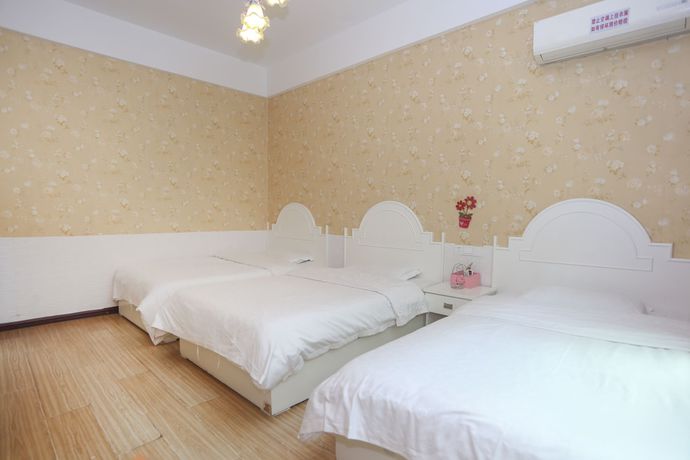 Imagen de la habitación del Hotel AiShang Hostel. Foto 9