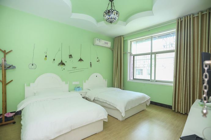 Imagen de la habitación del Hotel AiShang Hostel. Foto 16