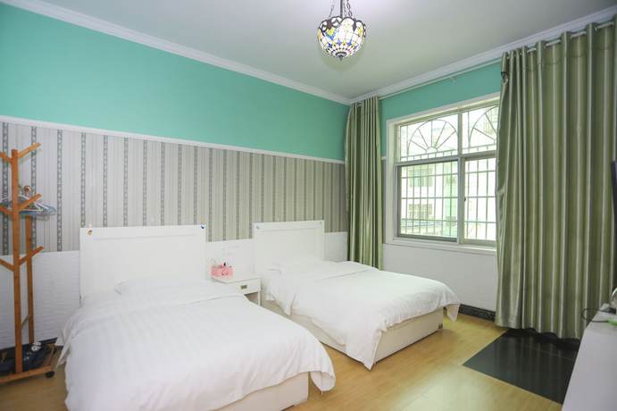 Imagen de la habitación del Hotel AiShang Hostel. Foto 19