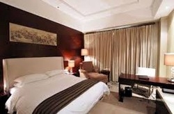 Imagen de la habitación del Hotel Aike Xinglinwan. Foto 2