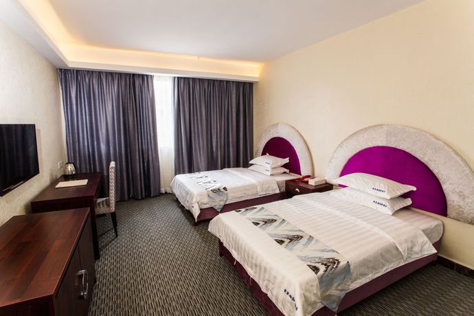 Imagen de la habitación del Hotel Aiqinhai. Foto 7