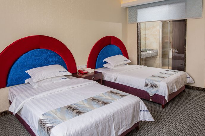Imagen de la habitación del Hotel Aiqinhai. Foto 8