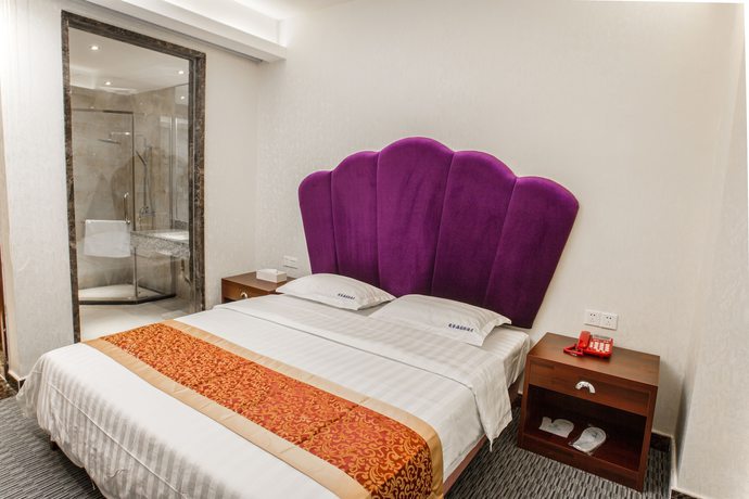 Imagen de la habitación del Hotel Aiqinhai. Foto 10
