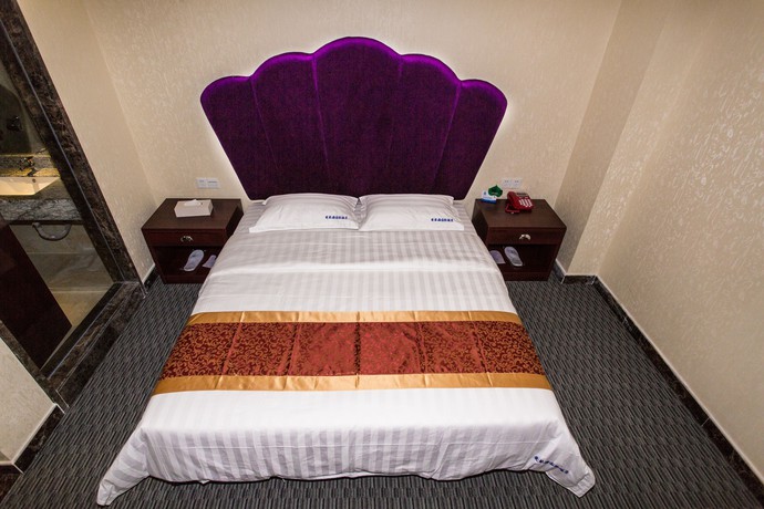 Imagen de la habitación del Hotel Aiqinhai. Foto 11