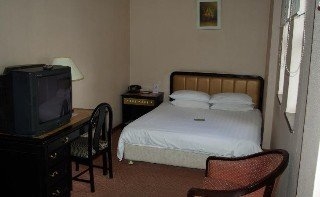 Imagen de la habitación del Hotel Aiqun East Building. Foto 2