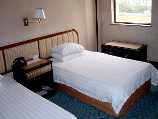 Imagen de la habitación del Hotel Aiqun East Building. Foto 4