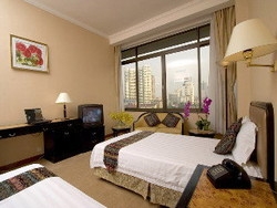 Imagen de la habitación del Hotel Aiqun East Building. Foto 7