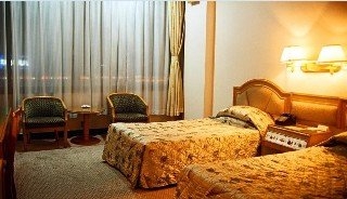 Imagen de la habitación del Hotel Aiqun East Building. Foto 9