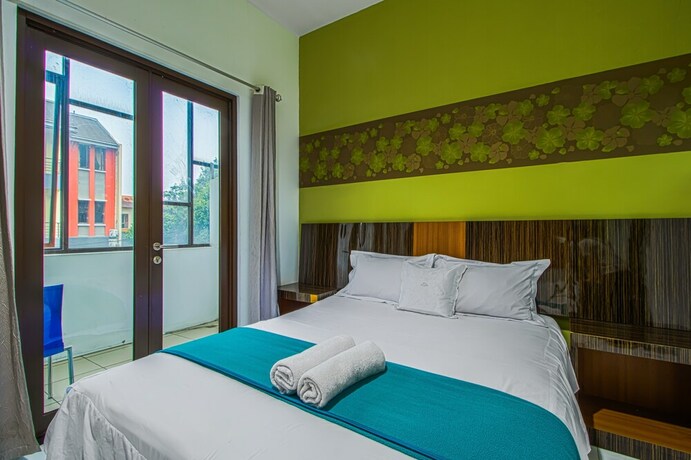 Imagen de la habitación del Hotel Aira Rooms Anggrek Serat Bsd. Foto 2