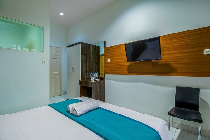 Imagen de la habitación del Hotel Aira Rooms Anggrek Serat Bsd. Foto 5