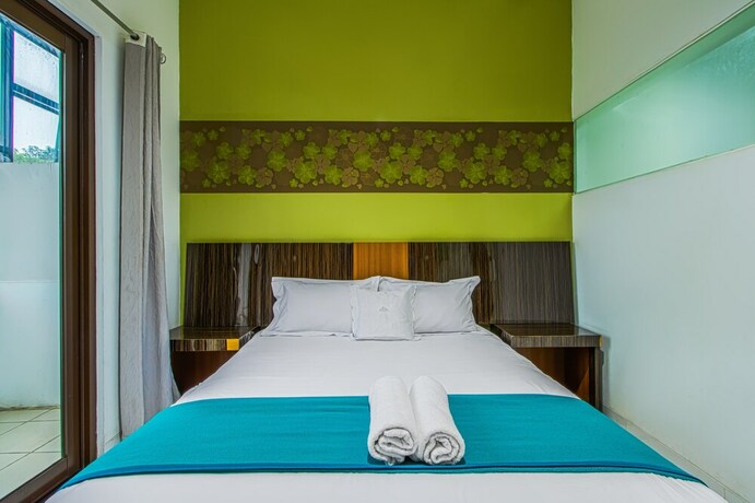 Imagen de la habitación del Hotel Aira Rooms Anggrek Serat Bsd. Foto 7