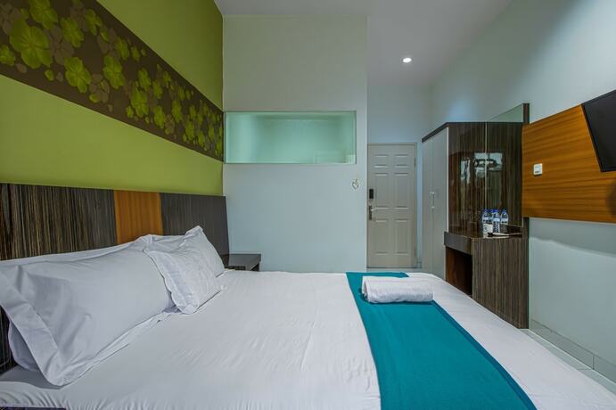 Imagen de la habitación del Hotel Aira Rooms Anggrek Serat Bsd. Foto 11