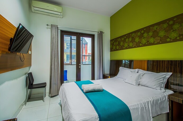 Imagen de la habitación del Hotel Aira Rooms Anggrek Serat Bsd. Foto 12