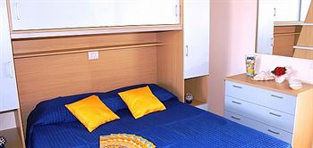 Imagen de la habitación del Hotel Airone Bianco Residence Village. Foto 7