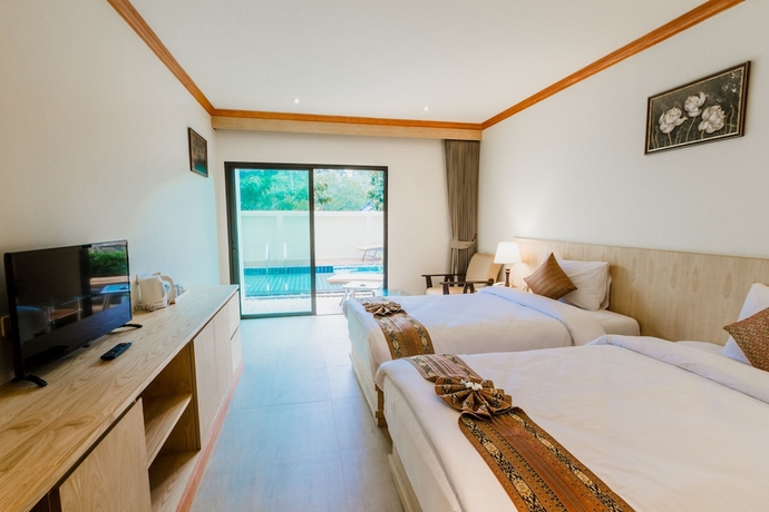 Imagen de la habitación del Hotel Airport Beach Hotel Phuket. Foto 4