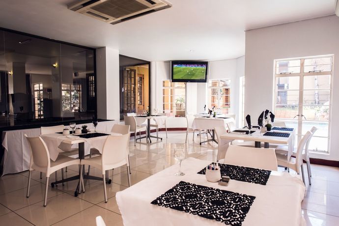 Imagen del bar/restaurante del Hotel Airport Inn and Suites. Foto 2