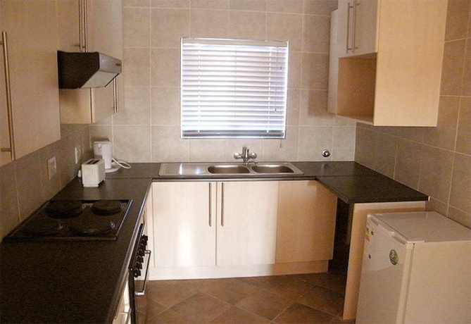 Imagen de la habitación del Hotel Airport Lodge Guest House. Foto 13