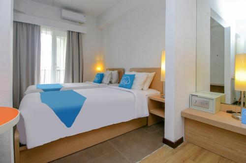Imagen de la habitación del Hotel Airy Premier Seminyak Cendrawasih 28 Kuta Bali. Foto 6