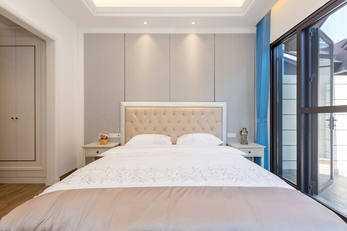 Imagen de la habitación del Hotel Aishangjia. Foto 21