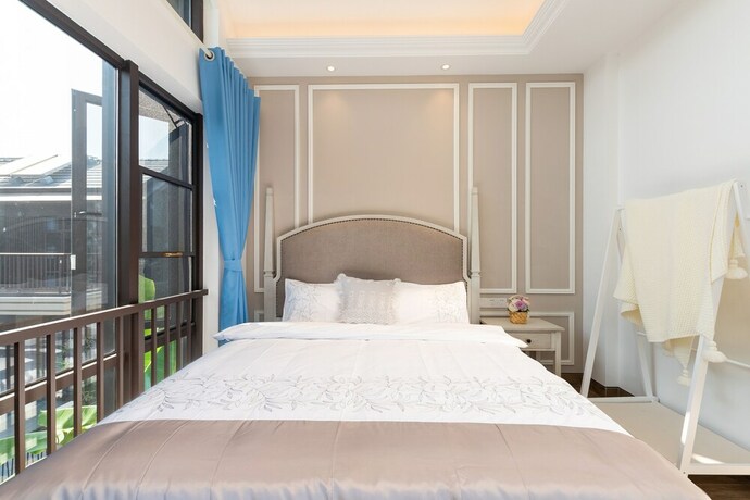 Imagen de la habitación del Hotel Aishangjia. Foto 23