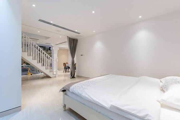 Imagen de la habitación del Hotel Aishangjia. Foto 33