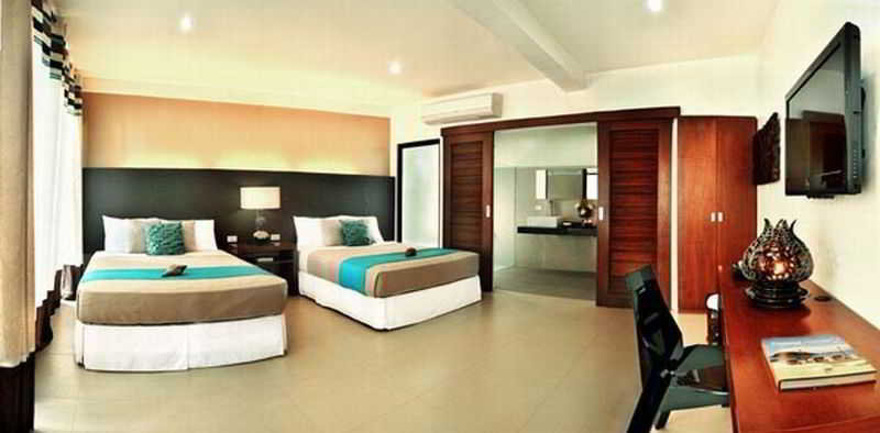 Imagen de la habitación del Hotel Aiyanar Beach and Dive Resort. Foto 9