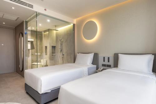 Imagen de la habitación del Hotel Akara Hotel Pattaya. Foto 12