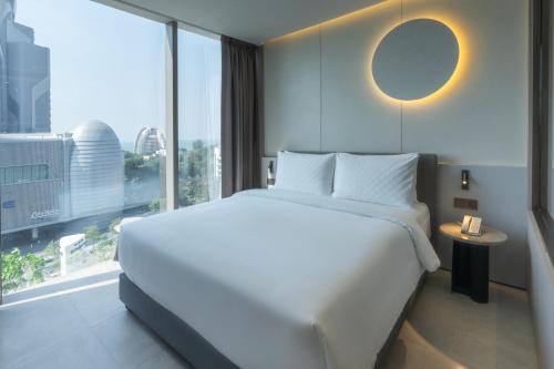 Imagen de la habitación del Hotel Akara Hotel Pattaya. Foto 17