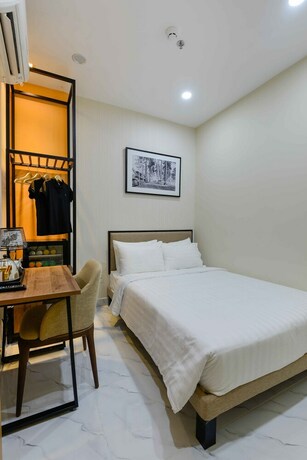 Imagen de la habitación del Hotel Akoya Saigon Central. Foto 23