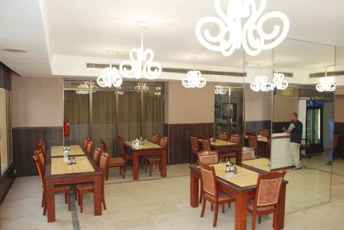 Imagen del bar/restaurante del Hotel Al Buhairah Apartments. Foto 2