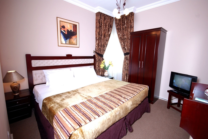 Imagen de la habitación del Hotel Al Bustan Tower Suites. Foto 5