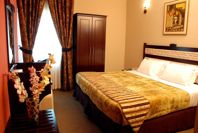 Imagen de la habitación del Hotel Al Bustan Tower Suites. Foto 8