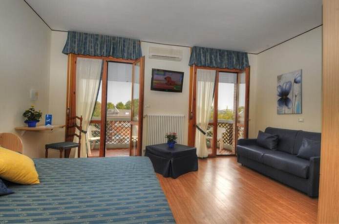 Imagen de la habitación del Hotel Al Cavallino Bianco, Lignano Sabbiadoro. Foto 12