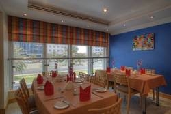 Imagen del bar/restaurante del Hotel Al Diar Palm Suites. Foto 4