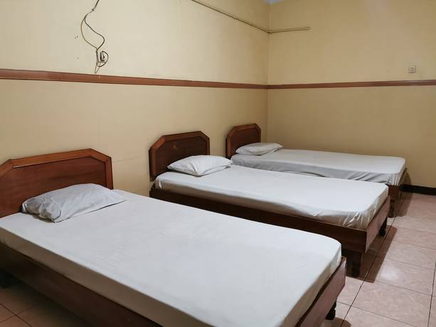 Imagen de la habitación del Hotel Al Hakim Syariah. Foto 5