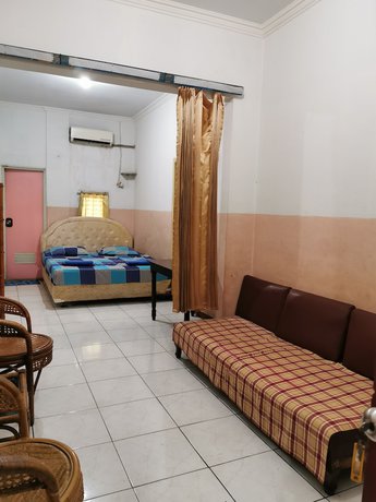 Imagen de la habitación del Hotel Al Hakim Syariah. Foto 7